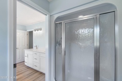Come explore this beautifully renovated 3,100-square-foot home on Sea Trail Golf Resort in North Carolina - for sale on GolfHomes.com, golf home, golf lot