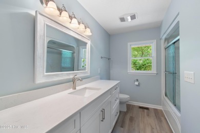 Come explore this beautifully renovated 3,100-square-foot home on Sea Trail Golf Resort in North Carolina - for sale on GolfHomes.com, golf home, golf lot