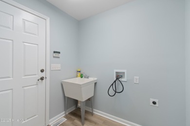Come explore this beautifully renovated 3,100-square-foot home on Sea Trail Golf Resort in North Carolina - for sale on GolfHomes.com, golf home, golf lot