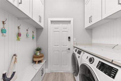 THIS IS LUXURY LIVING IN GATEWAY ! RENOVATED 4 BEDROOM AND 3 on Gateway Golf and Country Club in Florida - for sale on GolfHomes.com, golf home, golf lot