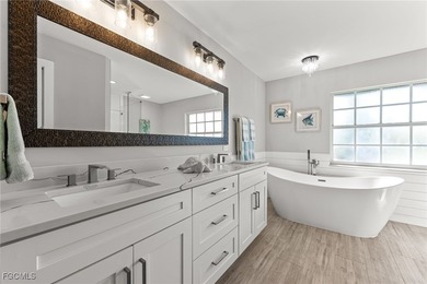 THIS IS LUXURY LIVING IN GATEWAY ! RENOVATED 4 BEDROOM AND 3 on Gateway Golf and Country Club in Florida - for sale on GolfHomes.com, golf home, golf lot