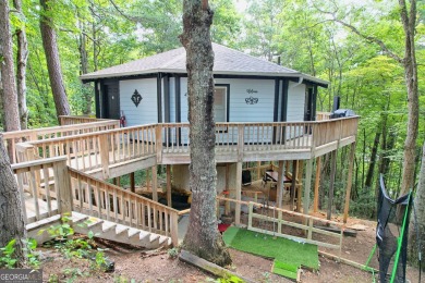 Feels like a treehouse. Perfect starter or vacation rental on Sky Valley Resort and Country Club in Georgia - for sale on GolfHomes.com, golf home, golf lot