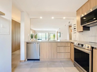 Exquisite FULLY FURNISHED 2-Bed/2-Bath 1st floor Condo Just on Isla Del Sol Yacht and Country Club in Florida - for sale on GolfHomes.com, golf home, golf lot