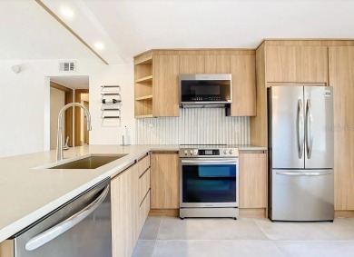 Exquisite FULLY FURNISHED 2-Bed/2-Bath 1st floor Condo Just on Isla Del Sol Yacht and Country Club in Florida - for sale on GolfHomes.com, golf home, golf lot