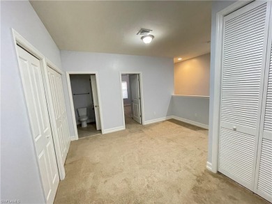 Freshly painted townhouse with master bedroom in downstairs on Vanderbilt Country Club in Florida - for sale on GolfHomes.com, golf home, golf lot