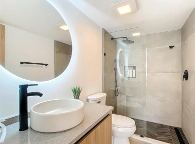 Exquisite FULLY FURNISHED 2-Bed/2-Bath 1st floor Condo Just on Isla Del Sol Yacht and Country Club in Florida - for sale on GolfHomes.com, golf home, golf lot