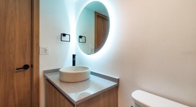 Exquisite FULLY FURNISHED 2-Bed/2-Bath 1st floor Condo Just on Isla Del Sol Yacht and Country Club in Florida - for sale on GolfHomes.com, golf home, golf lot
