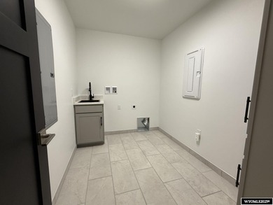 Step into this incredible custom-built home at 4225 Windsong on Riverton Country Club in Wyoming - for sale on GolfHomes.com, golf home, golf lot