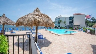 Exquisite FULLY FURNISHED 2-Bed/2-Bath 1st floor Condo Just on Isla Del Sol Yacht and Country Club in Florida - for sale on GolfHomes.com, golf home, golf lot
