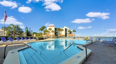 Exquisite FULLY FURNISHED 2-Bed/2-Bath 1st floor Condo Just on Isla Del Sol Yacht and Country Club in Florida - for sale on GolfHomes.com, golf home, golf lot