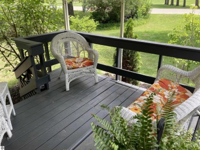 This beautifully maintained and recently updated home has 400 ft on Elk Rapids Golf Club in Michigan - for sale on GolfHomes.com, golf home, golf lot