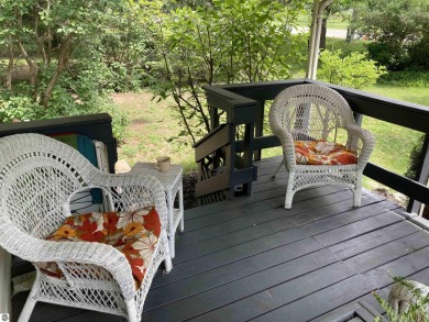 This beautifully maintained and recently updated home has 400 ft on Elk Rapids Golf Club in Michigan - for sale on GolfHomes.com, golf home, golf lot