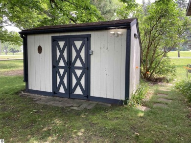 This beautifully maintained and recently updated home has 400 ft on Elk Rapids Golf Club in Michigan - for sale on GolfHomes.com, golf home, golf lot