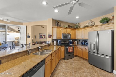 This exceptionally maintained 3-bedroom home in Sun City Grand on Sun City Grand Golf Couse and Club in Arizona - for sale on GolfHomes.com, golf home, golf lot