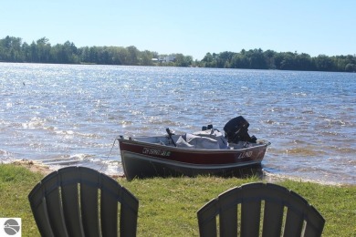 This beautifully maintained and recently updated home has 400 ft on Elk Rapids Golf Club in Michigan - for sale on GolfHomes.com, golf home, golf lot