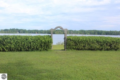 This beautifully maintained and recently updated home has 400 ft on Elk Rapids Golf Club in Michigan - for sale on GolfHomes.com, golf home, golf lot