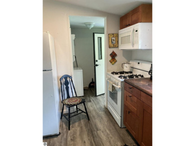 This beautifully maintained and recently updated home has 400 ft on Elk Rapids Golf Club in Michigan - for sale on GolfHomes.com, golf home, golf lot