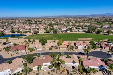 This exceptionally maintained 3-bedroom home in Sun City Grand on Sun City Grand Golf Couse and Club in Arizona - for sale on GolfHomes.com, golf home, golf lot