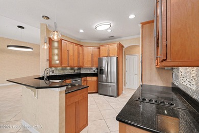 Beautiful custom lakefront home located on the Viera East Golf on Viera East Golf Club in Florida - for sale on GolfHomes.com, golf home, golf lot