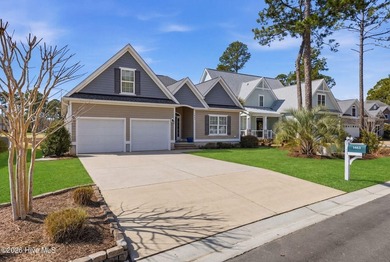 It is all about the view! This charming 3BR/2BA home has an on Carolina National Golf Club in North Carolina - for sale on GolfHomes.com, golf home, golf lot
