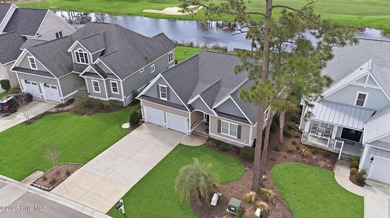 It is all about the view! This charming 3BR/2BA home has an on Carolina National Golf Club in North Carolina - for sale on GolfHomes.com, golf home, golf lot