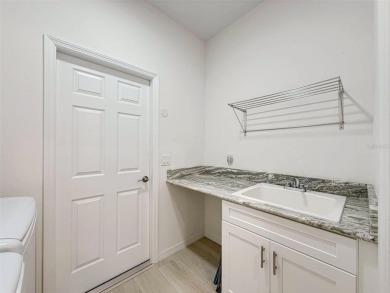 Enjoy Florida living at its finest in this beautifully on Meadow Oaks Golf and Country Club in Florida - for sale on GolfHomes.com, golf home, golf lot
