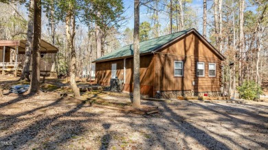 CHARMING LOG CABIN STYLE BUILD-OVER SITS PRETTY ON TRIPLE LOT!!! on River Golf and Country Club at Lake Royale in North Carolina - for sale on GolfHomes.com, golf home, golf lot