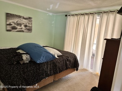 Discover move-in-ready convenience in this charming 2-bedroom on Heritage Pines Country Club in Florida - for sale on GolfHomes.com, golf home, golf lot