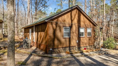 CHARMING LOG CABIN STYLE BUILD-OVER SITS PRETTY ON TRIPLE LOT!!! on River Golf and Country Club at Lake Royale in North Carolina - for sale on GolfHomes.com, golf home, golf lot