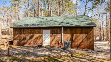 CHARMING LOG CABIN STYLE BUILD-OVER SITS PRETTY ON TRIPLE LOT!!! on River Golf and Country Club at Lake Royale in North Carolina - for sale on GolfHomes.com, golf home, golf lot
