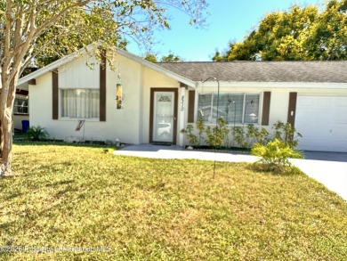 Discover move-in-ready convenience in this charming 2-bedroom on Heritage Pines Country Club in Florida - for sale on GolfHomes.com, golf home, golf lot