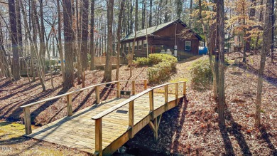 CHARMING LOG CABIN STYLE BUILD-OVER SITS PRETTY ON TRIPLE LOT!!! on River Golf and Country Club at Lake Royale in North Carolina - for sale on GolfHomes.com, golf home, golf lot