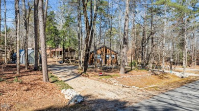 CHARMING LOG CABIN STYLE BUILD-OVER SITS PRETTY ON TRIPLE LOT!!! on River Golf and Country Club at Lake Royale in North Carolina - for sale on GolfHomes.com, golf home, golf lot