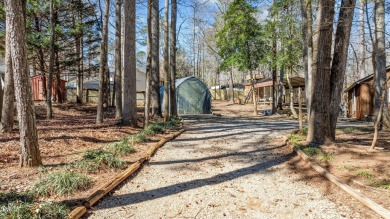 CHARMING LOG CABIN STYLE BUILD-OVER SITS PRETTY ON TRIPLE LOT!!! on River Golf and Country Club at Lake Royale in North Carolina - for sale on GolfHomes.com, golf home, golf lot
