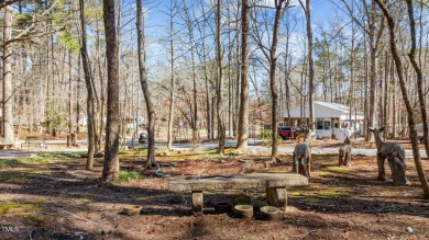 CHARMING LOG CABIN STYLE BUILD-OVER SITS PRETTY ON TRIPLE LOT!!! on River Golf and Country Club at Lake Royale in North Carolina - for sale on GolfHomes.com, golf home, golf lot
