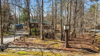 CHARMING LOG CABIN STYLE BUILD-OVER SITS PRETTY ON TRIPLE LOT!!! on River Golf and Country Club at Lake Royale in North Carolina - for sale on GolfHomes.com, golf home, golf lot