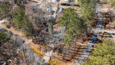 CHARMING LOG CABIN STYLE BUILD-OVER SITS PRETTY ON TRIPLE LOT!!! on River Golf and Country Club at Lake Royale in North Carolina - for sale on GolfHomes.com, golf home, golf lot