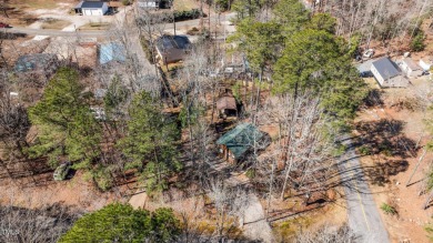 CHARMING LOG CABIN STYLE BUILD-OVER SITS PRETTY ON TRIPLE LOT!!! on River Golf and Country Club at Lake Royale in North Carolina - for sale on GolfHomes.com, golf home, golf lot