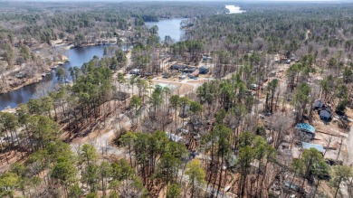 CHARMING LOG CABIN STYLE BUILD-OVER SITS PRETTY ON TRIPLE LOT!!! on River Golf and Country Club at Lake Royale in North Carolina - for sale on GolfHomes.com, golf home, golf lot