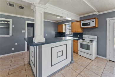 Welcome to 938 Woodlawn Drive, a charming one story home on Oso Beach Municipal Golf Course in Texas - for sale on GolfHomes.com, golf home, golf lot