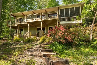 Lakefront living with both water and mountain views! Tucked away on Rumbling Bald Resort on Lake Lure in North Carolina - for sale on GolfHomes.com, golf home, golf lot