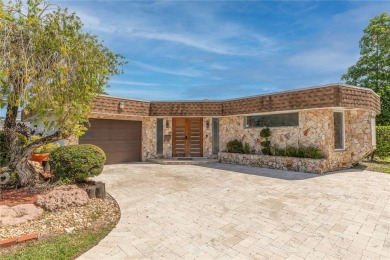 Welcome to this beautifully designed single-family home that on Woodlands Country Club in Florida - for sale on GolfHomes.com, golf home, golf lot
