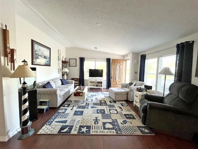 1700+ S.F. 2/bd, 2/ba home w/ Den is situated on a beautiful on Del Tura Golf and Country Club in Florida - for sale on GolfHomes.com, golf home, golf lot