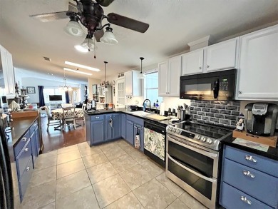1700+ S.F. 2/bd, 2/ba home w/ Den is situated on a beautiful on Del Tura Golf and Country Club in Florida - for sale on GolfHomes.com, golf home, golf lot