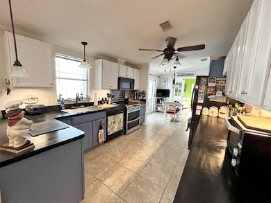1700+ S.F. 2/bd, 2/ba home w/ Den is situated on a beautiful on Del Tura Golf and Country Club in Florida - for sale on GolfHomes.com, golf home, golf lot