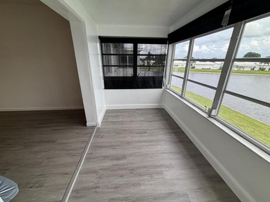 Enjoy expansive, picturesque water views from this completely on Leisureville Community Golf Course in Florida - for sale on GolfHomes.com, golf home, golf lot