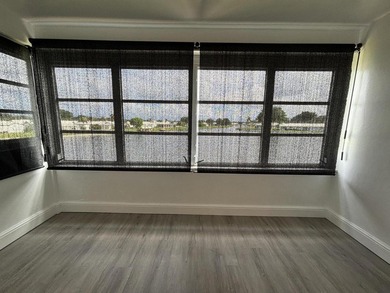 Enjoy expansive, picturesque water views from this completely on Leisureville Community Golf Course in Florida - for sale on GolfHomes.com, golf home, golf lot