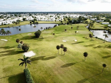 Enjoy expansive, picturesque water views from this completely on Leisureville Community Golf Course in Florida - for sale on GolfHomes.com, golf home, golf lot