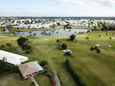 Enjoy expansive, picturesque water views from this completely on Leisureville Community Golf Course in Florida - for sale on GolfHomes.com, golf home, golf lot