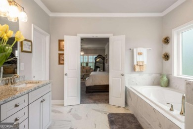 Located in Lakeview-Heron Bay's only gated section-this elegant on Canongate At Heron Bay in Georgia - for sale on GolfHomes.com, golf home, golf lot